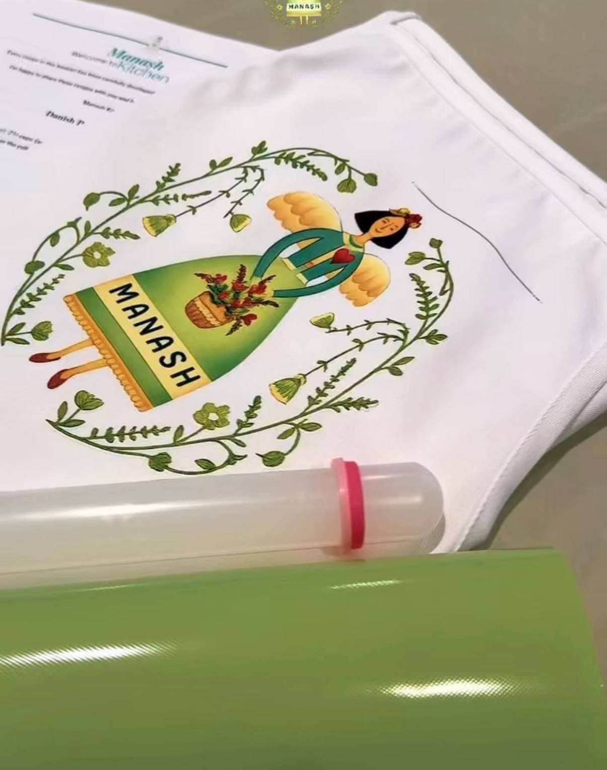 A Manash apron and recipe booklet